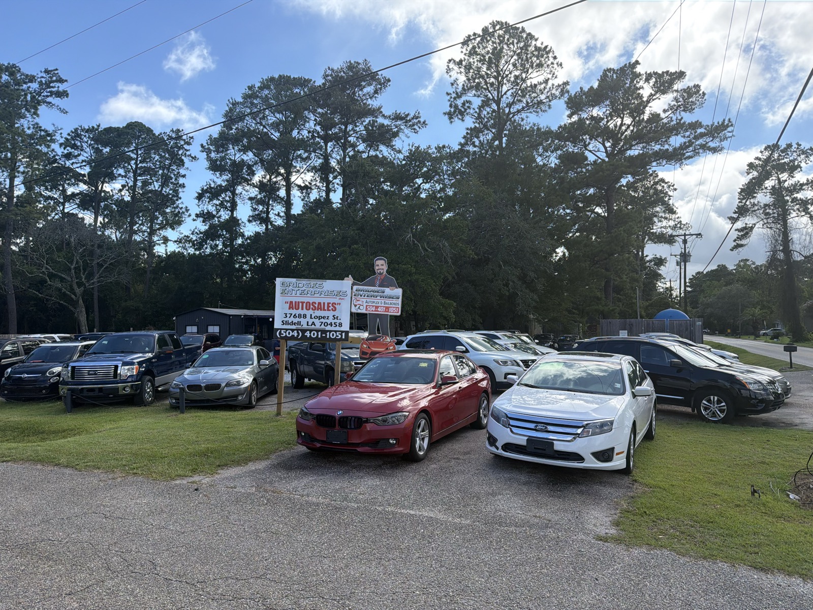 The Bridges Enterprises Autoplex lot in Slidell, Louisiana, with vehicles for sale and the company sign
