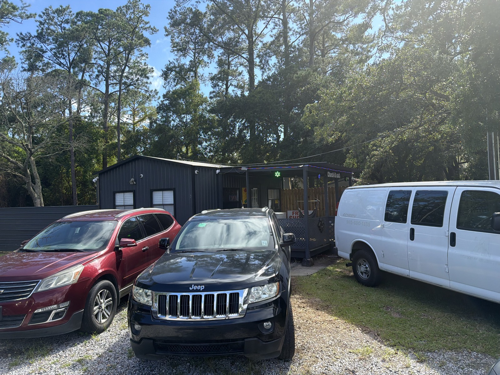 Vehicles parked in front of the Bridges Enterprises office